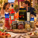 Sommer Genuss Paket Italien – Aperol, Kaffee, Olivenöl & Feinkost Spezialitäten – Italienische Tischatmosphäre mit Gästen